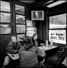 Customers at John's Deli in Bensonhurst, one of Brooklyn's most famous places for hero sandwiches, munched down as 'The Godfather' played on deli's televisions at lunchtime